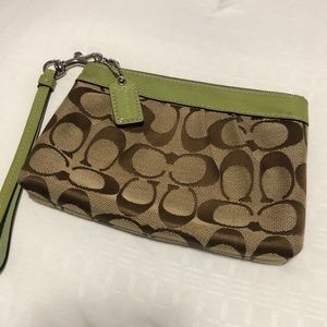 Brown and green Coach wristlet